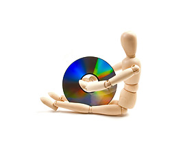 Image showing wood mannequin with CD-rom