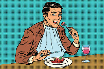 Image showing Elegant retro man eats in the restaurant and drinking wine