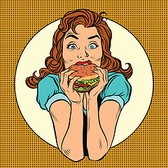 Image showing Young woman eating Burger