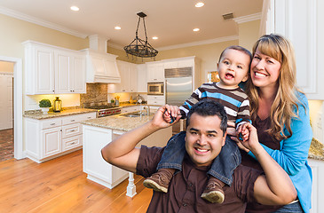 Image showing Young Mixed Race Family Having Fun in Custom Kitchen