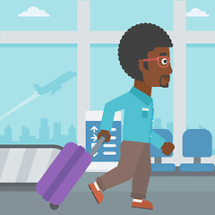 Image showing Man walking with suitcase at the airport.
