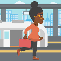 Image showing Woman at the train station vector illustration.