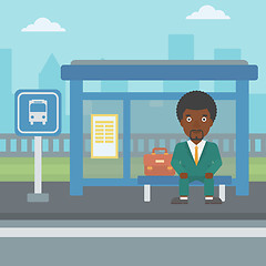 Image showing Man waiting for bus at the bus stop.