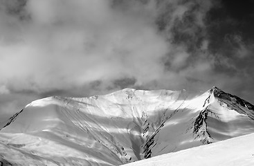 Image showing Black and white view on off-piste snowy slope in wind day