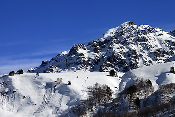 Image showing Off-piste slope with track from avalanche on sunny day