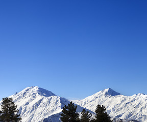 Image showing Snowy mountains and blue clear sky at nice sun morning