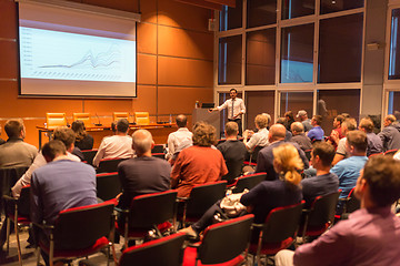 Image showing Business speaker giving a talk in conference hall.