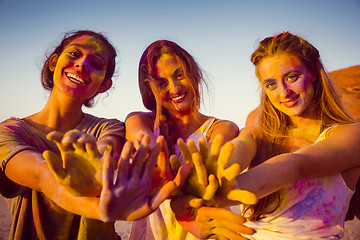 Image showing Playing with colored powder