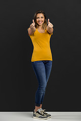 Image showing Happy woman with thumb up