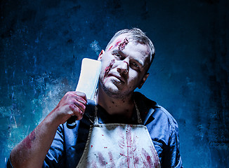 Image showing Bloody Halloween theme: crazy killer as butcher with a knife