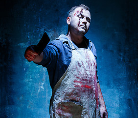 Image showing Bloody Halloween theme: crazy killer as butcher with a knife