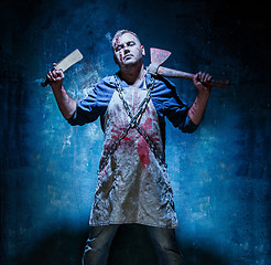 Image showing Bloody Halloween theme: crazy killer as butcher with an ax