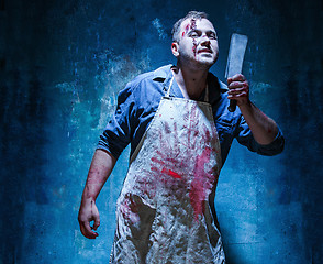 Image showing Bloody Halloween theme: crazy killer as butcher with a knife