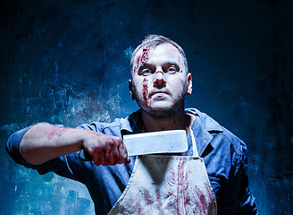 Image showing Bloody Halloween theme: crazy killer as butcher with a knife