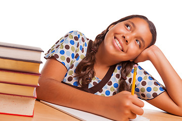 Image showing Pretty Hispanic Girl Daydreaming While Studying on White