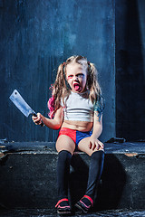 Image showing Bloody Halloween theme: The funny crasy girl with knife