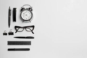 Image showing The clock, pen, and glasses on white background