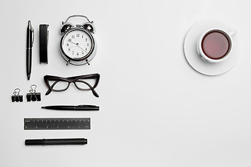 Image showing The clock, pen, and glasses on white background