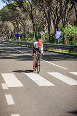 Image showing Grosseto, Italy - May 09, 2014: The cyclist without an arm and feet with the bike during the sporting event