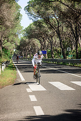 Image showing Grosseto, Italy - May 09, 2014: The cyclist without an arm and feet with the bike during the sporting event