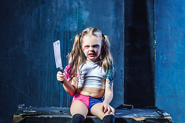 Image showing Horror shot: a scary evil girl with bloody knife