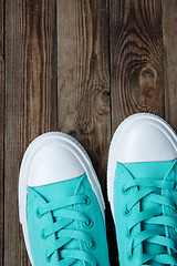 Image showing socks of shoes on wooden floor