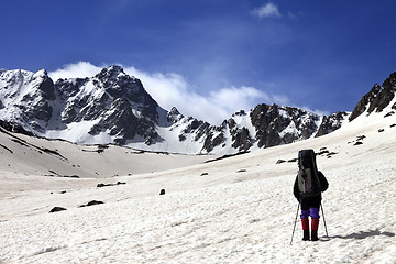 Image showing Hiker on snow plateau at spring mountain.