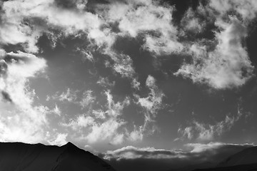 Image showing Black and white sky with clouds and mountains in evening