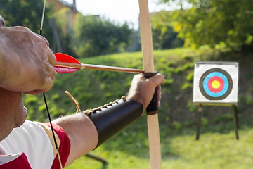 Image showing Medieval archer shoot at a target