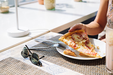 Image showing Unrecognizable woman eating pizza in cafe