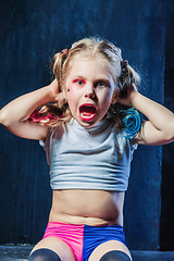 Image showing The funny crasy girl on dark background