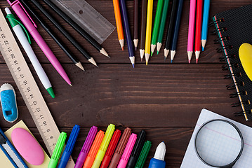 Image showing School supplies on a wooden table