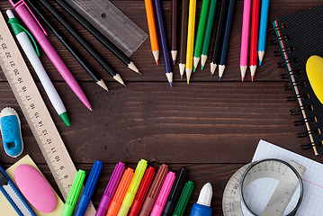 Image showing School supplies on a wooden table