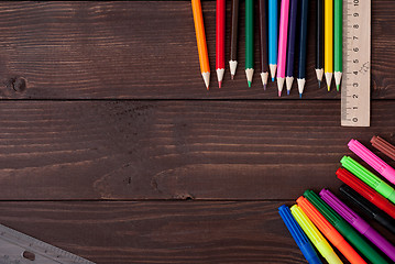 Image showing Colored pencils on a wooden board