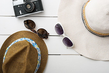 Image showing Beach accessories on wooden board