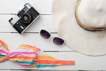 Image showing Beach accessories on wooden board