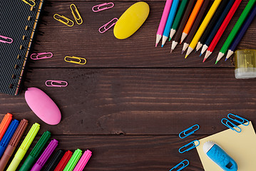 Image showing School supplies on a wooden table