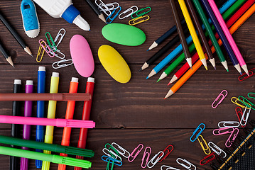 Image showing School supplies on a wooden table