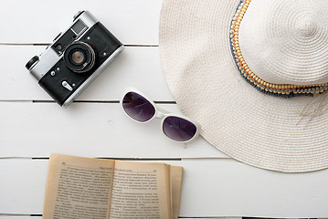 Image showing Beach accessories on wooden board