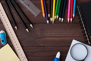 Image showing School supplies on a wooden table