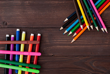 Image showing Colored pencils on a wooden board