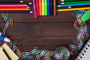 Image showing School supplies on a wooden table