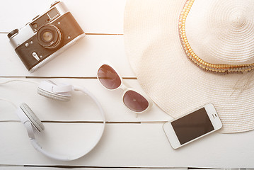 Image showing Beach accessories on wooden board