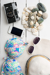 Image showing Beach accessories on wooden board