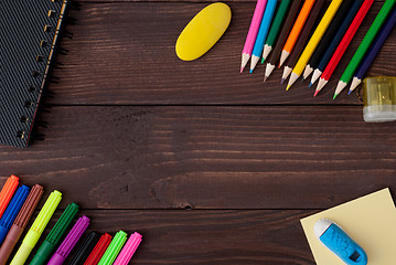 Image showing School supplies on a wooden table