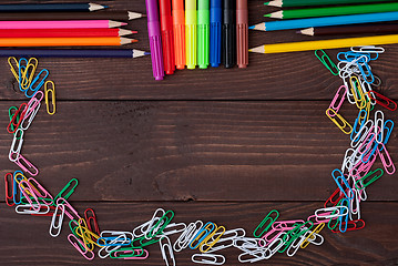 Image showing School supplies on a wooden table