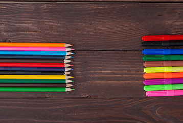 Image showing Colored pencils on a wooden board