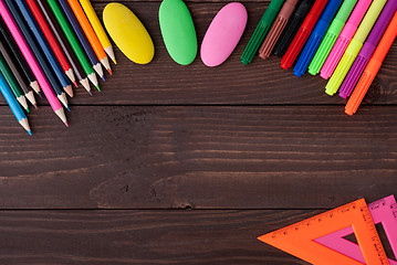 Image showing School supplies on a wooden table