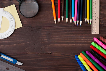 Image showing School supplies on a wooden table