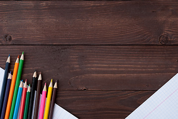 Image showing Colored pencils on a wooden board